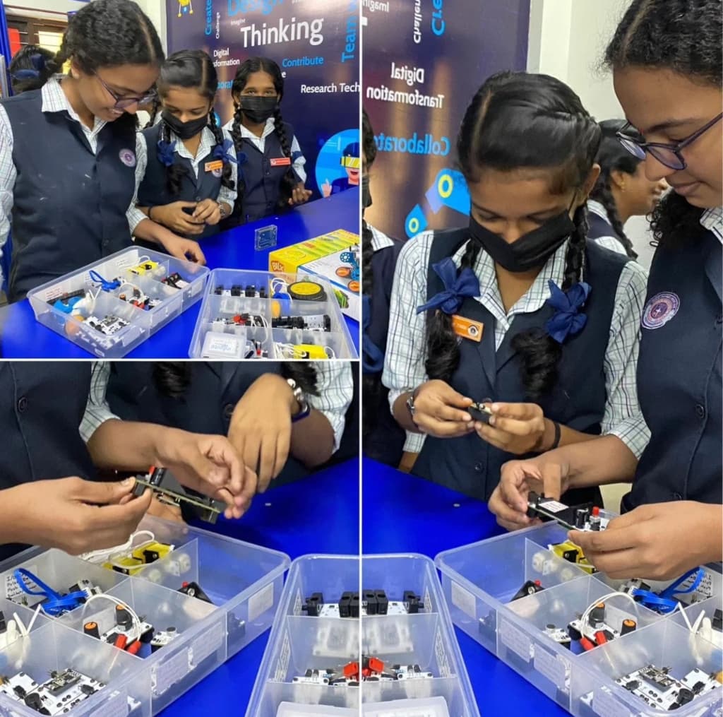 Students working with robotics kits at Mar Thoma Central School
